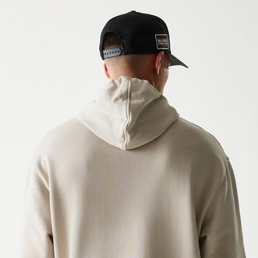 The Male model is wearing McLaren Racing Wordmark Light Beige Oversized Pullover Hoodie 7