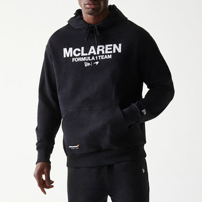 The Male model is wearing McLaren Racing Wordmark Black Oversized Pullover Hoodie 3