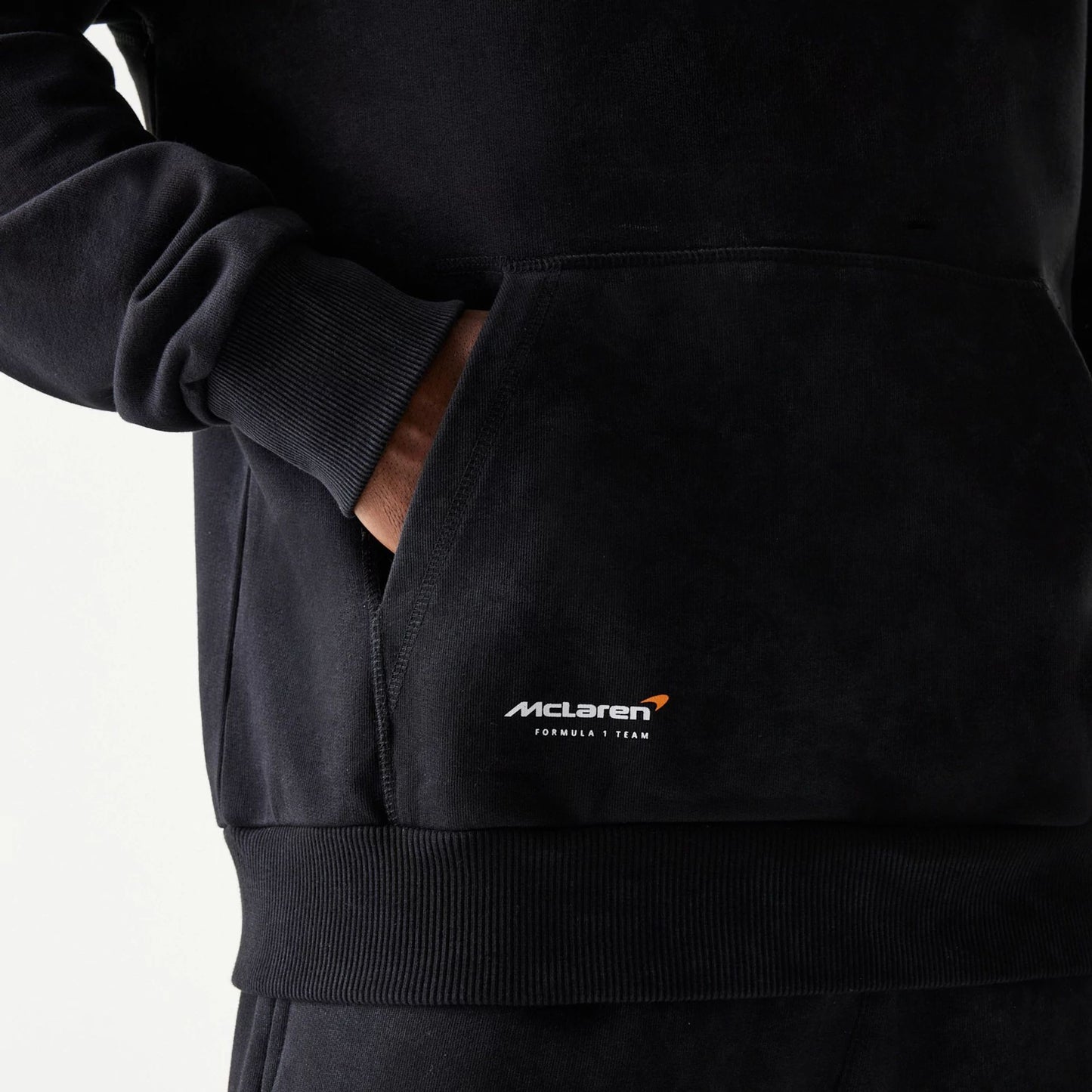 The Male model is wearing McLaren Racing Wordmark Black Oversized Pullover Hoodie 5