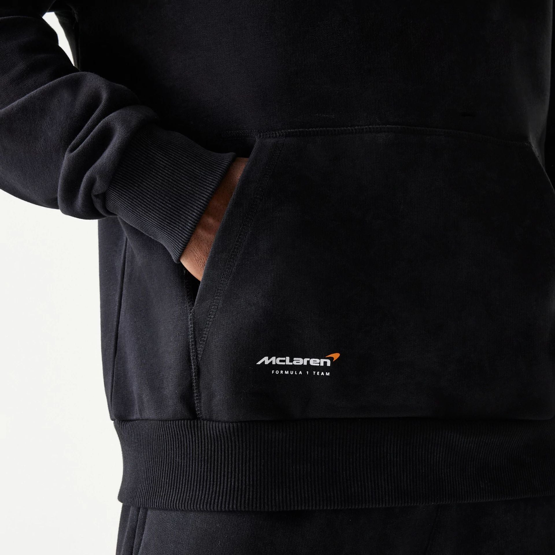 The Male model is wearing McLaren Racing Wordmark Black Oversized Pullover Hoodie 5