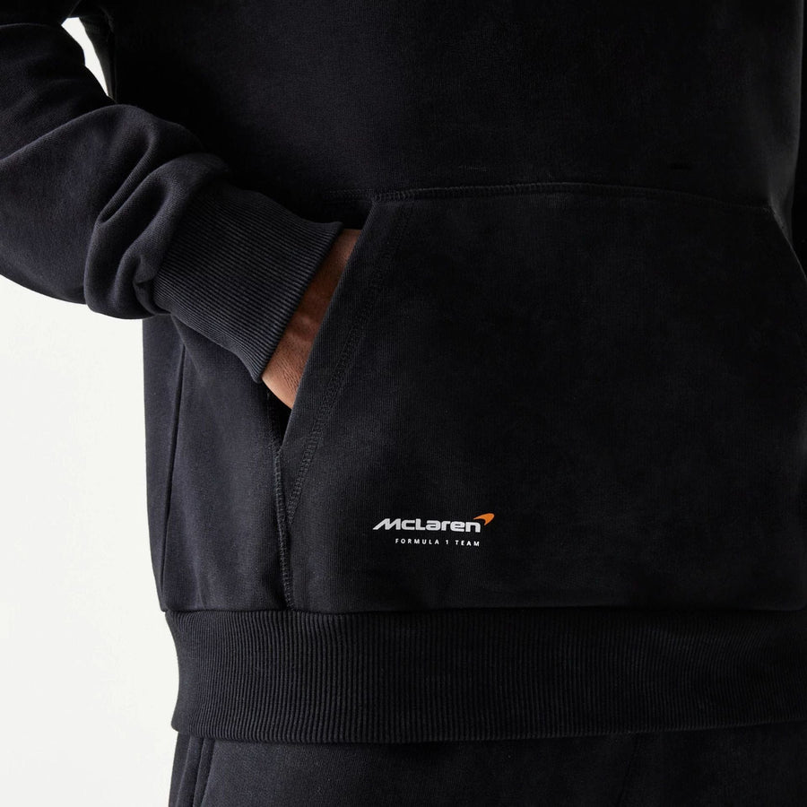 The Male model is wearing McLaren Racing Wordmark Black Oversized Pullover Hoodie 5