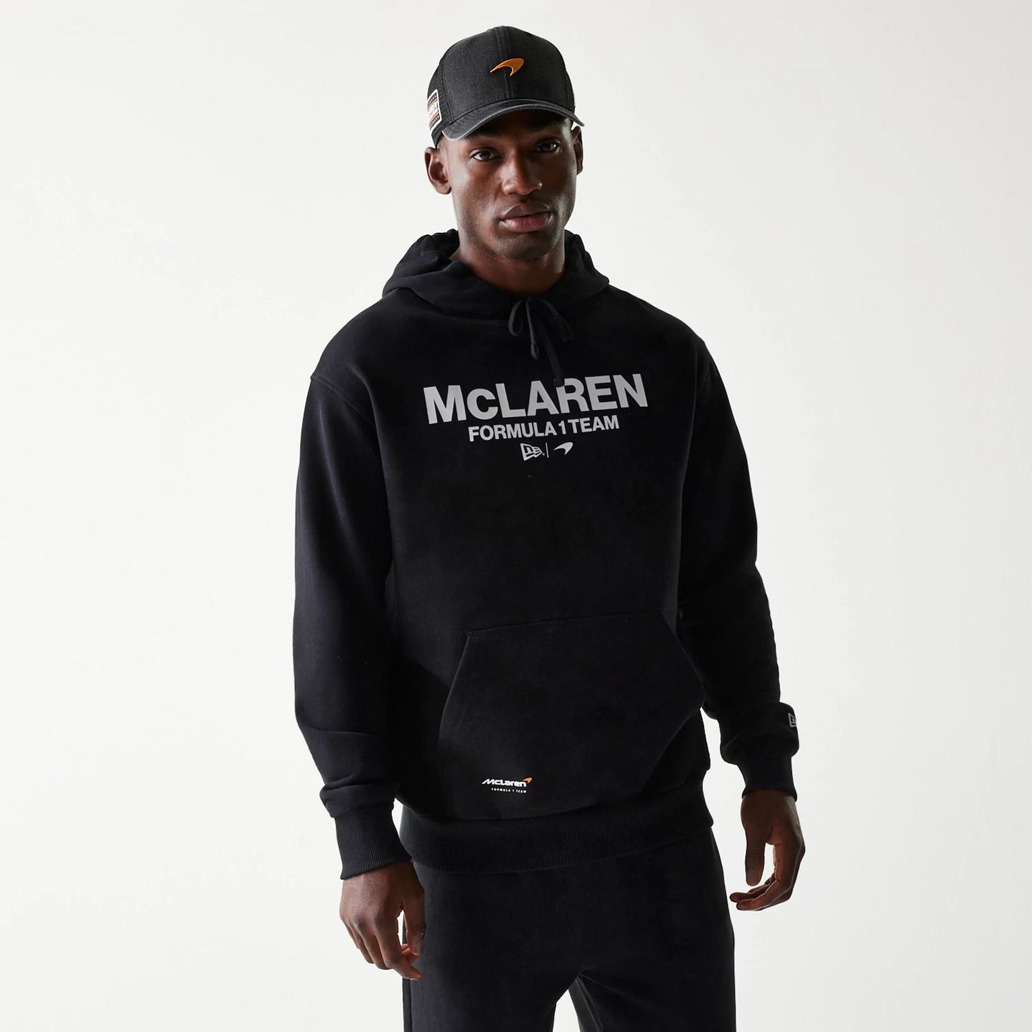 The Male model is wearing McLaren Racing Wordmark Black Oversized Pullover Hoodie 1