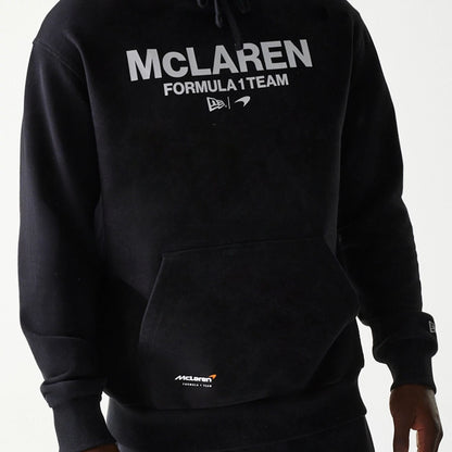The Male model is wearing McLaren Racing Wordmark Black Oversized Pullover Hoodie 6