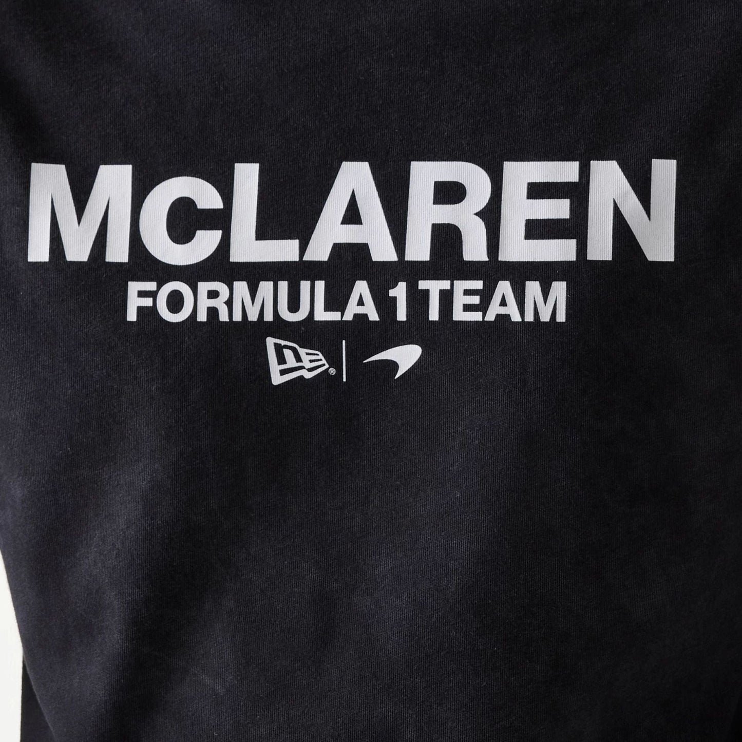 The Male model is wearing McLaren Racing Wordmark Black Oversized T-Shirt 4