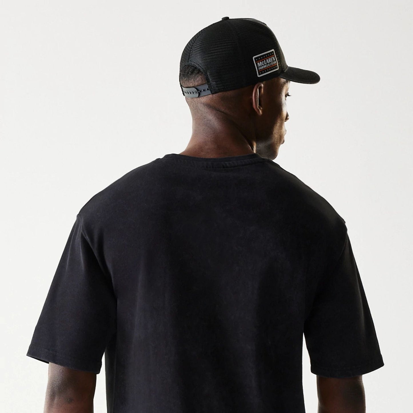 The Male model is wearing McLaren Racing Wordmark Black Oversized T-Shirt 7