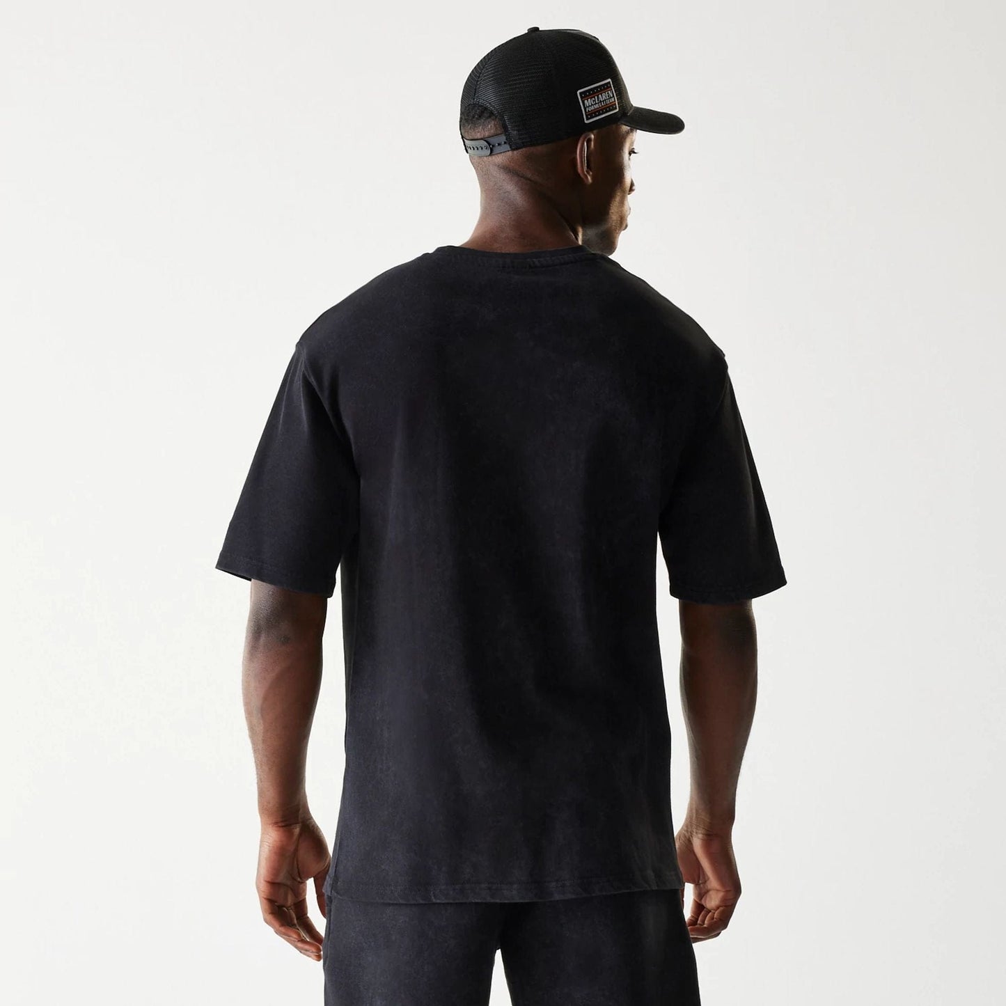 The Male model is wearing McLaren Racing Wordmark Black Oversized T-Shirt 2
