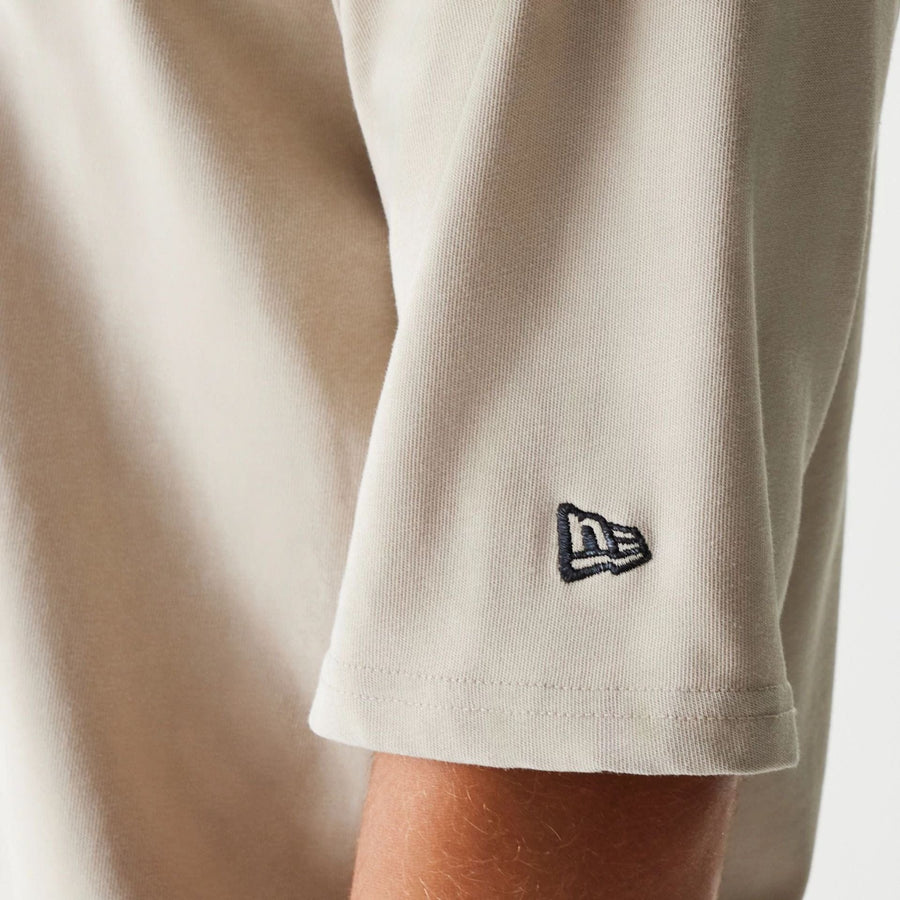 The Male model is wearing McLaren Racing Wordmark Light Beige Oversized T-Shirt 6