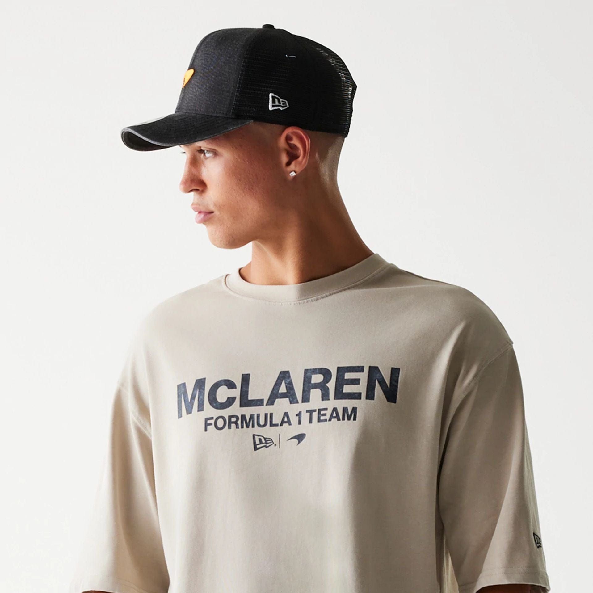 The Male model is wearing McLaren Racing Wordmark Light Beige Oversized T-Shirt 5