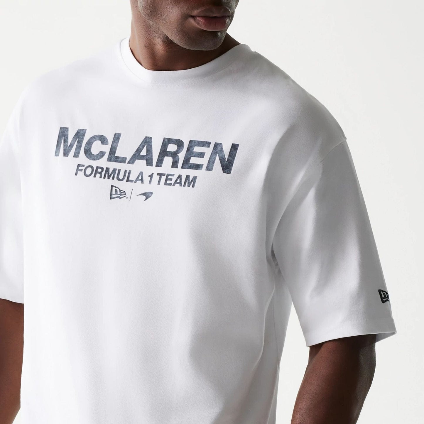 The Male model is wearing McLaren Racing Wordmark White Oversized T-Shirt 3