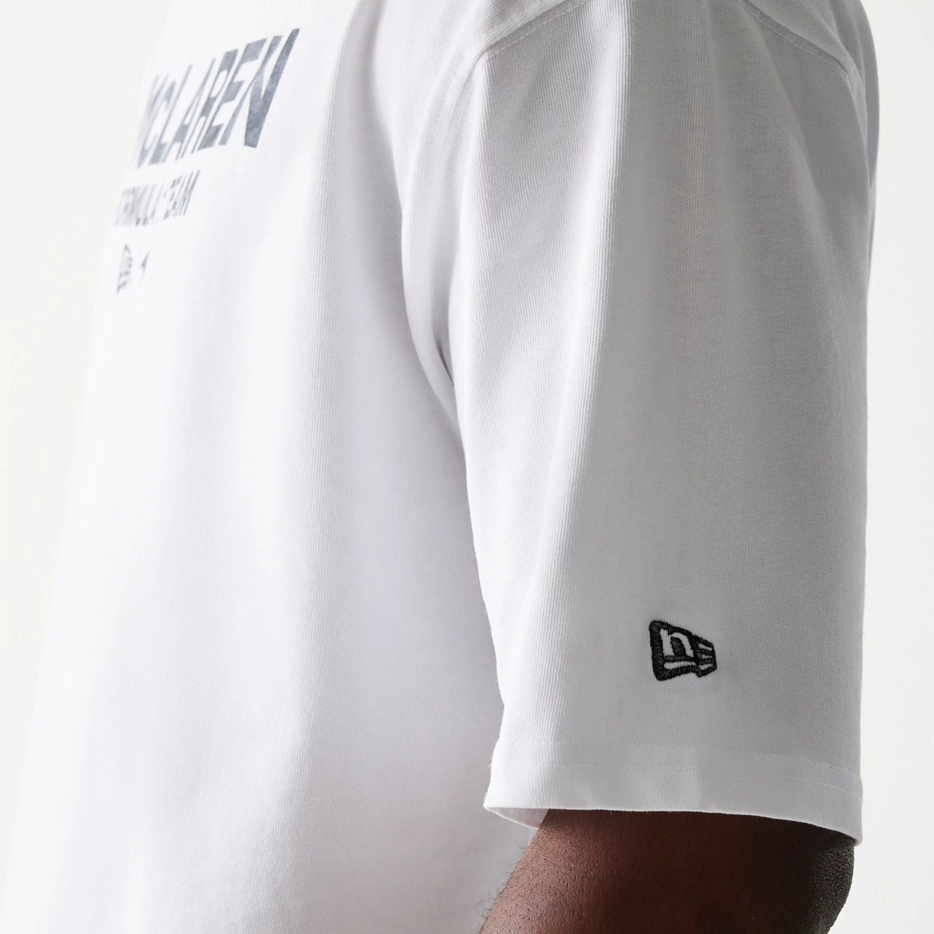 The Male model is wearing McLaren Racing Wordmark White Oversized T-Shirt 5