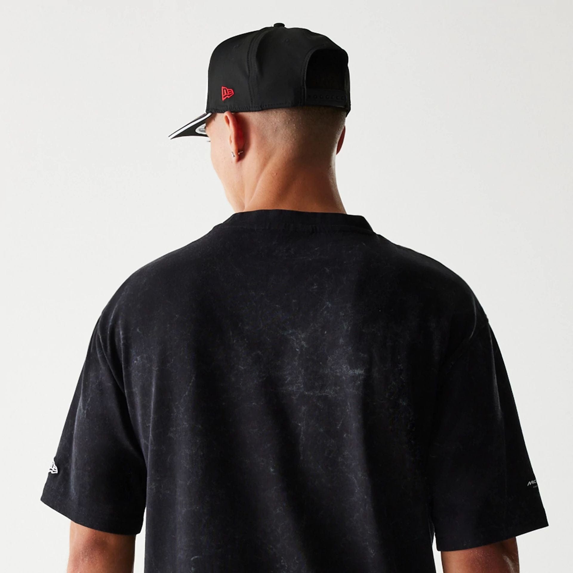 The Male model is wearing McLaren Racing Washed Graphic Black Oversized T-Shirt 7