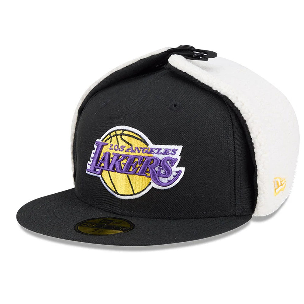 LA Lakers NBA Classic Black Dogear New Era 59FIFTY Fitted Cap, three-quarter view showing the purple and yellow embroidered team logo on the front panel, with white shearling-lined dogears and a black flat visor with gold 59FIFTY size sticker.