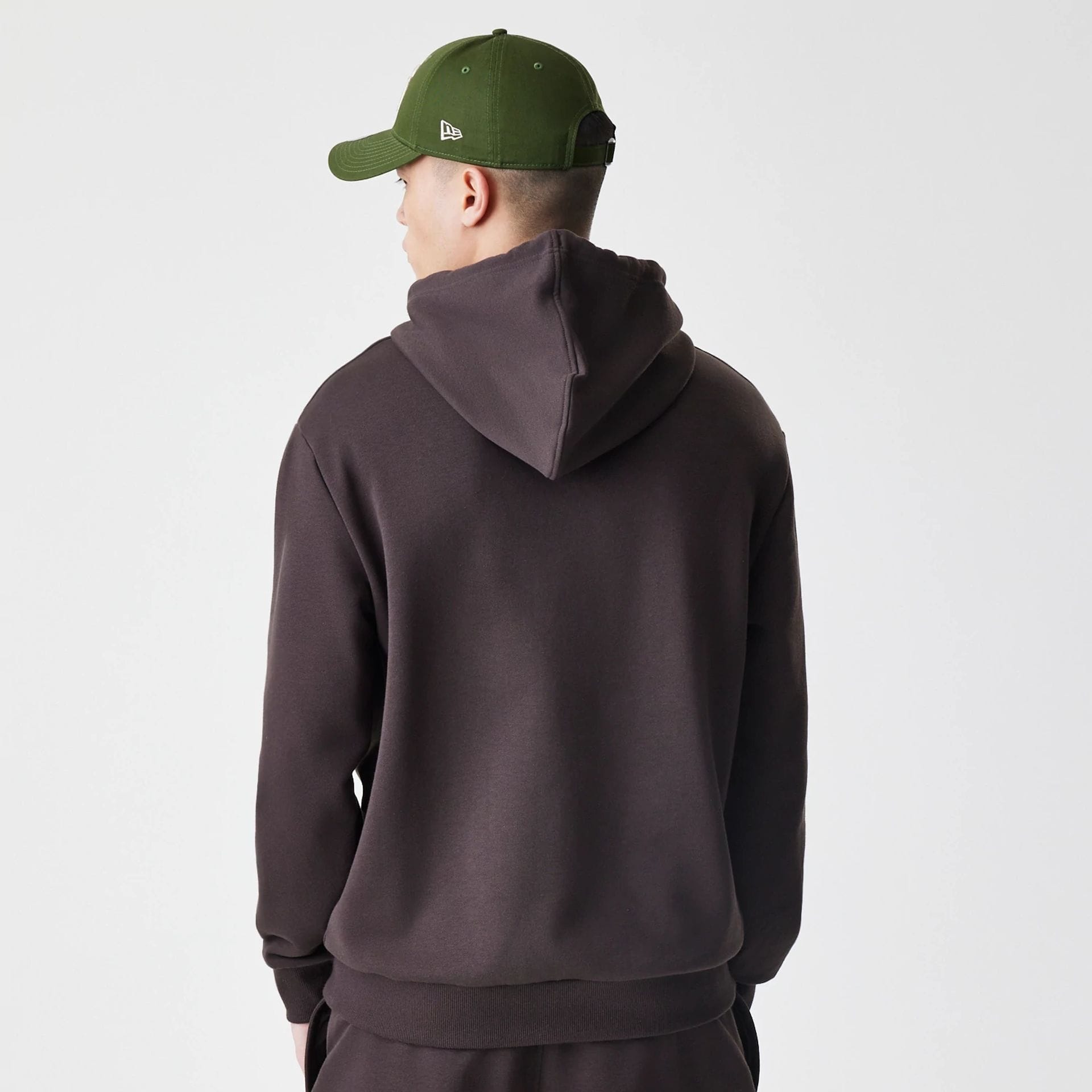 The Male model is wearing New York Yankees MLB Midi League Essential Dark Brown Oversized Pullover Hoodie  2