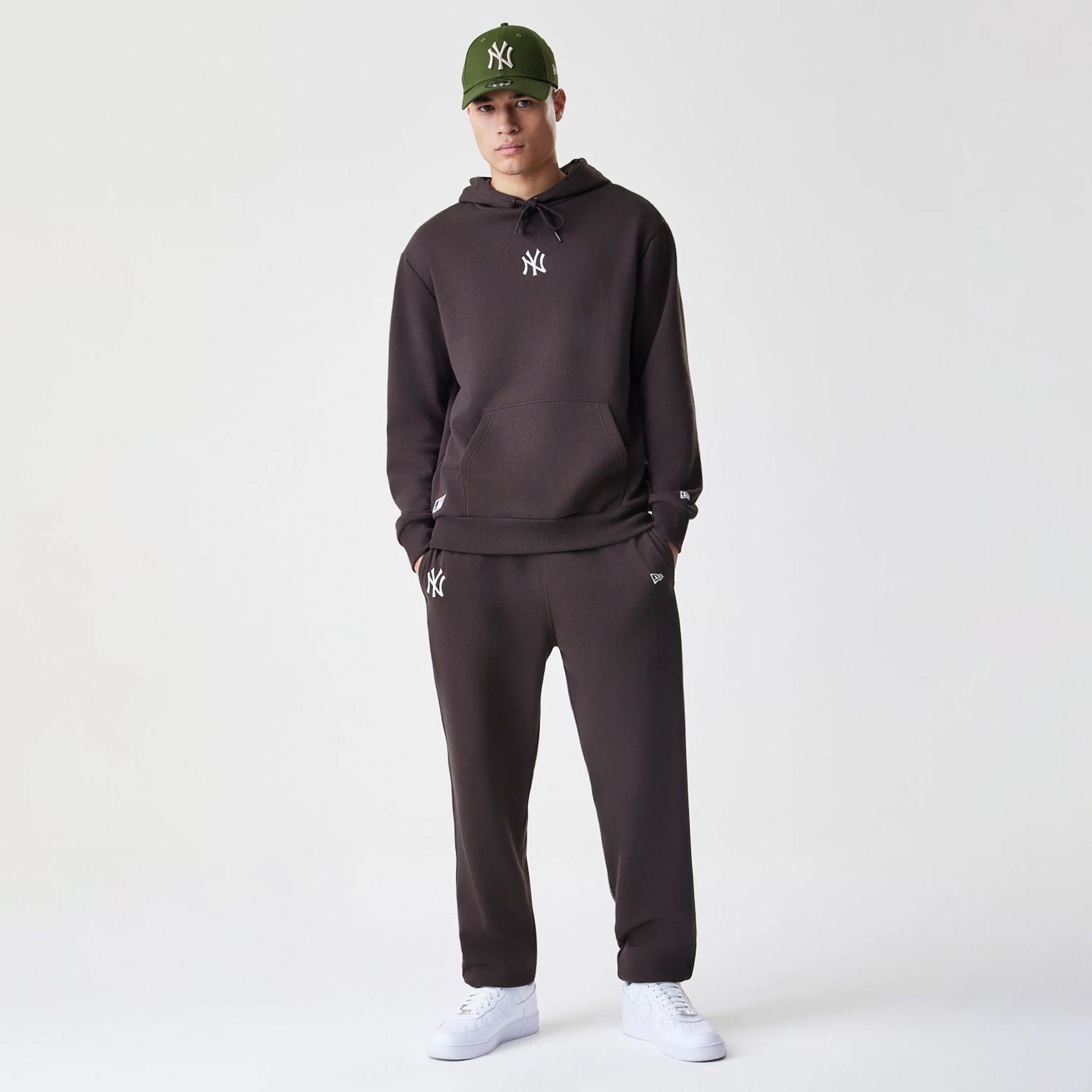 The Male model is wearing New York Yankees MLB Midi League Essential Dark Brown Oversized Pullover Hoodie  5