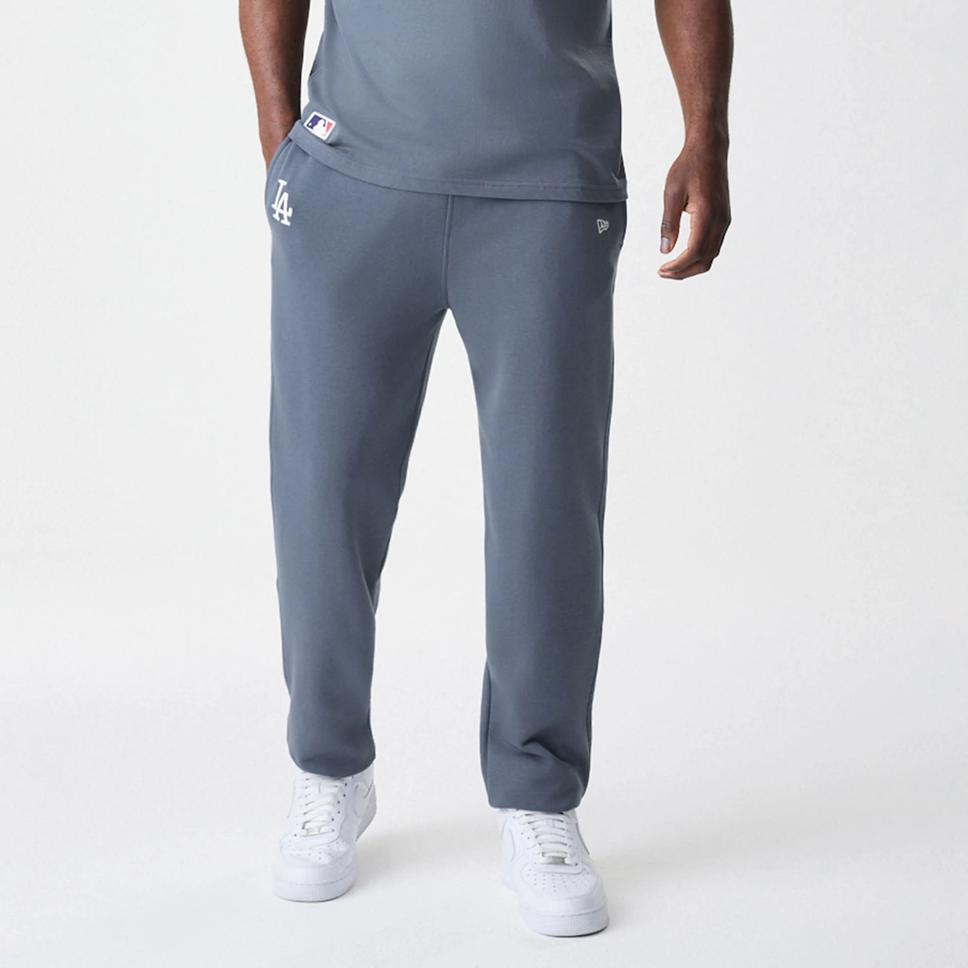 The Male model is wearing LA Dodgers MLB Midi League Essential Dark Grey Joggers  6