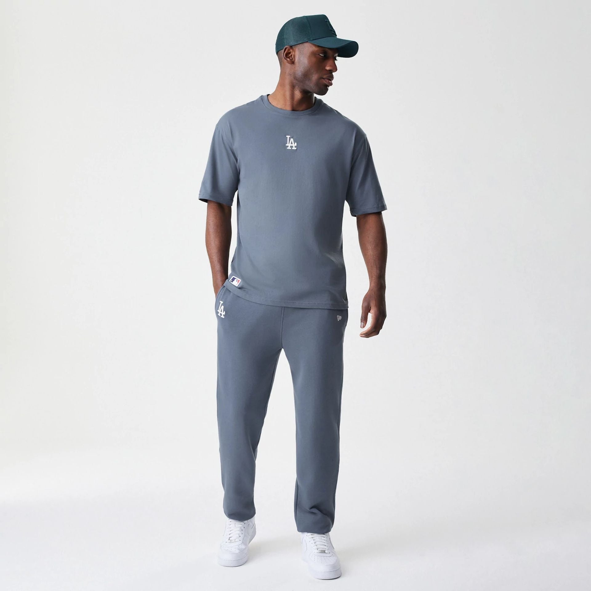 The Male model is wearing LA Dodgers MLB Midi League Essential Dark Grey Joggers  8