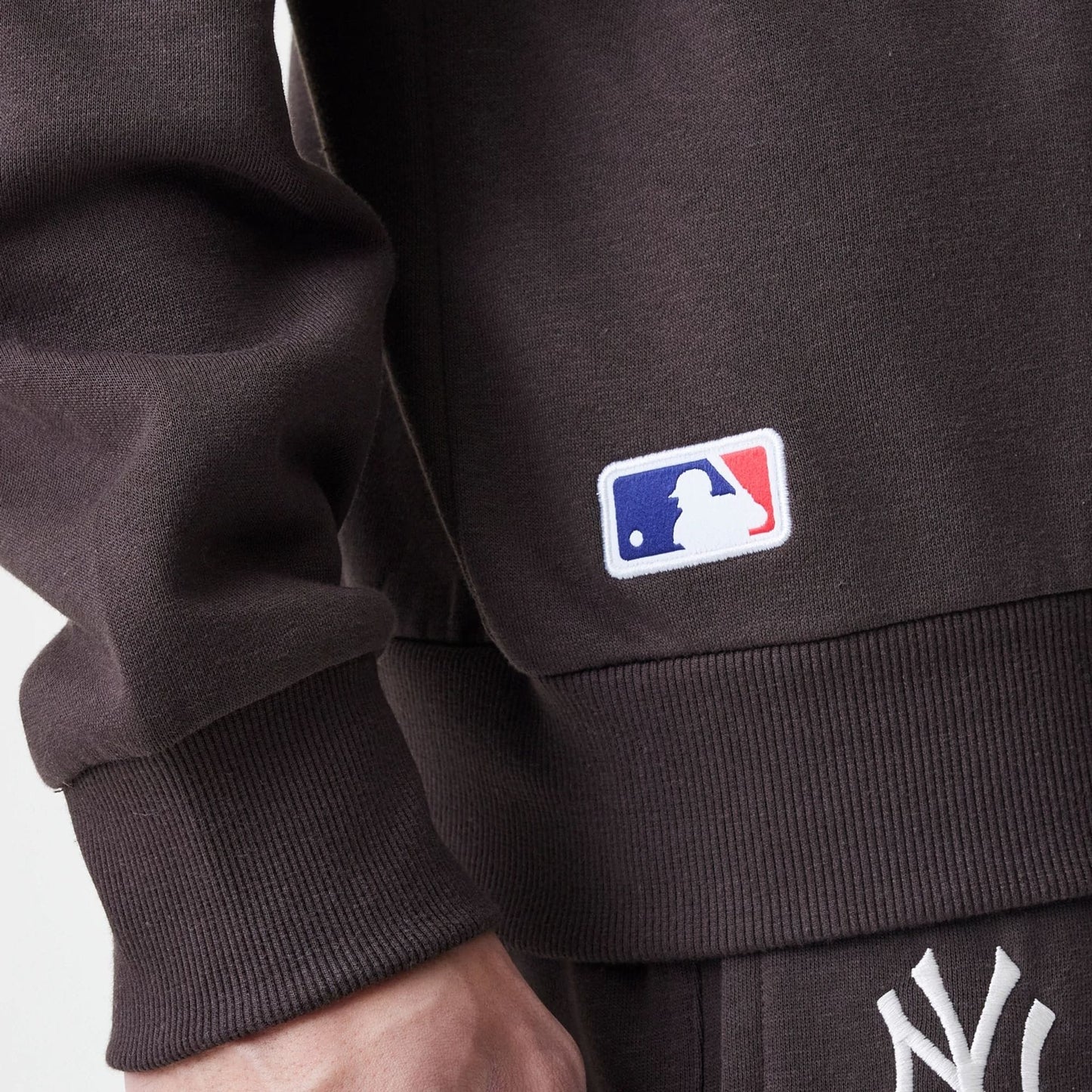 The Male model is wearing New York Yankees MLB Midi League Essential Dark Brown Oversized Crew Neck Sweater 6