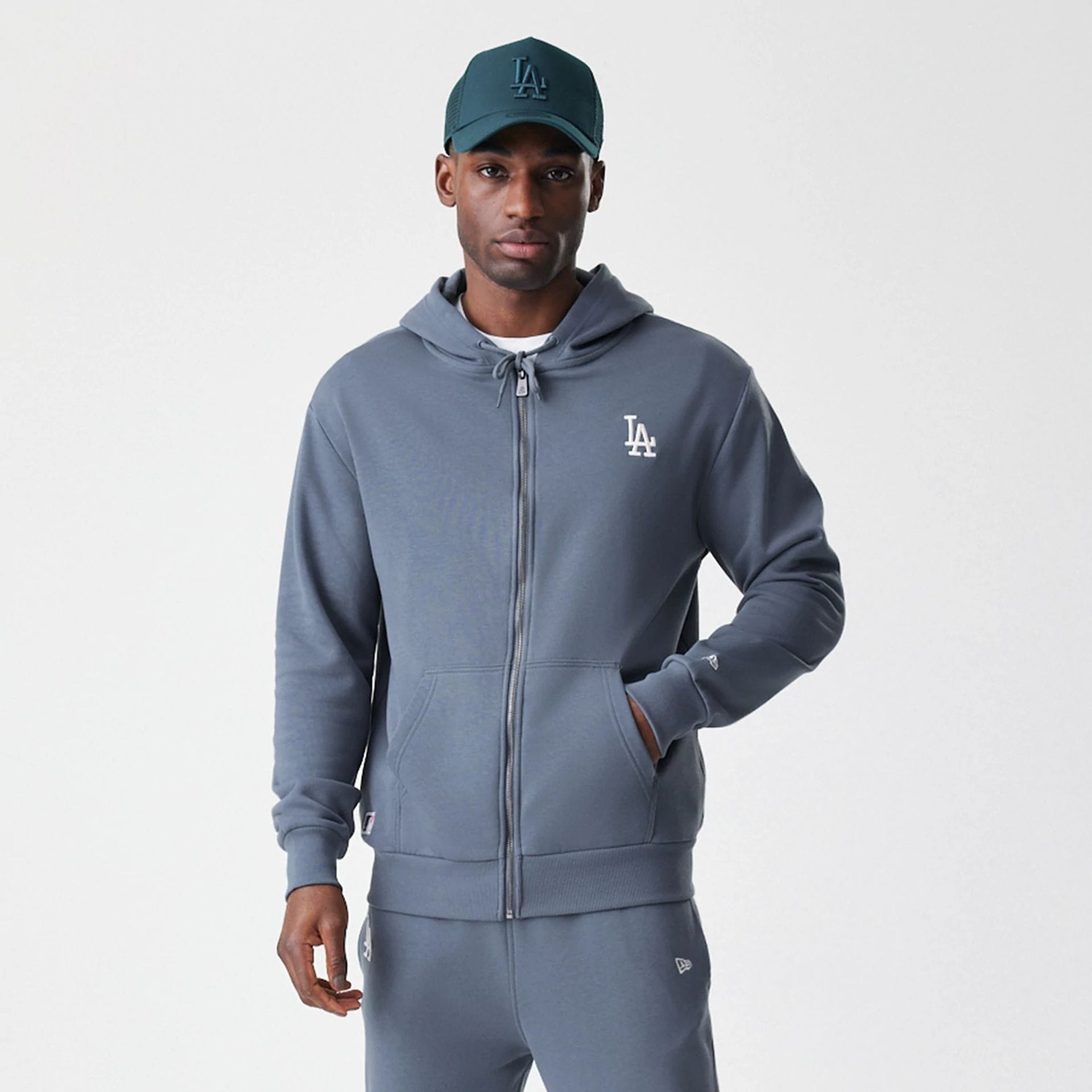 The Male model is wearing LA Dodgers MLB Midi League Essential Dark Grey Full Zip Hoodie  7