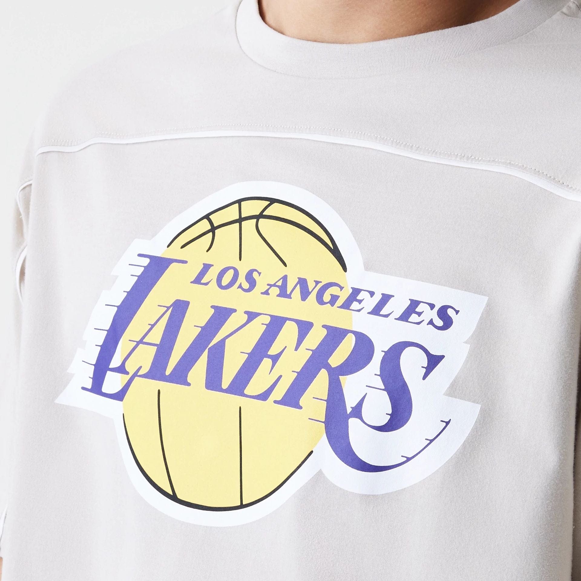 The Male model is wearing LA Lakers NBA Piping Light Beige Oversized T-Shirt  3