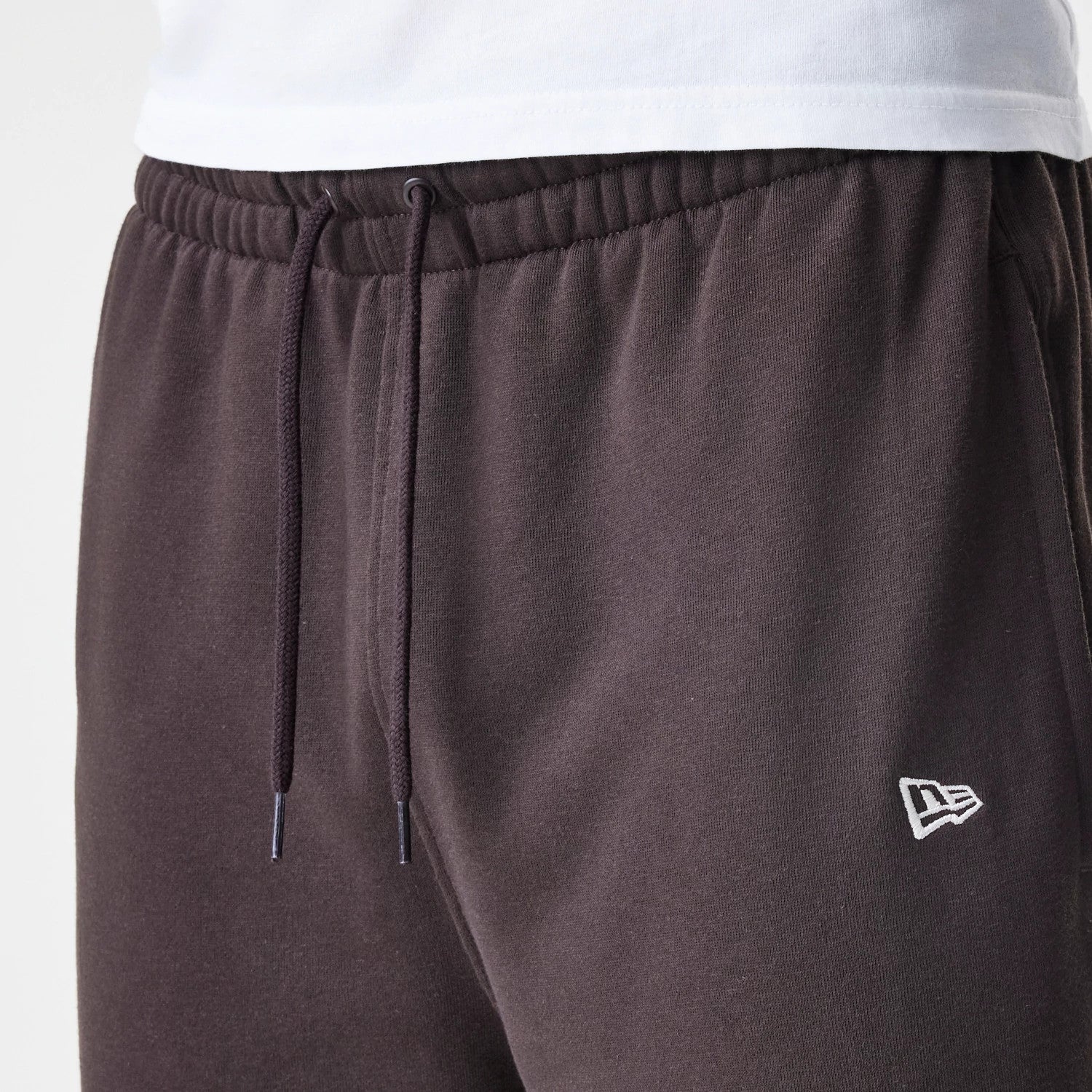 The Male model is wearing New York Yankees MLB Midi League Essential Dark Brown Joggers 6
