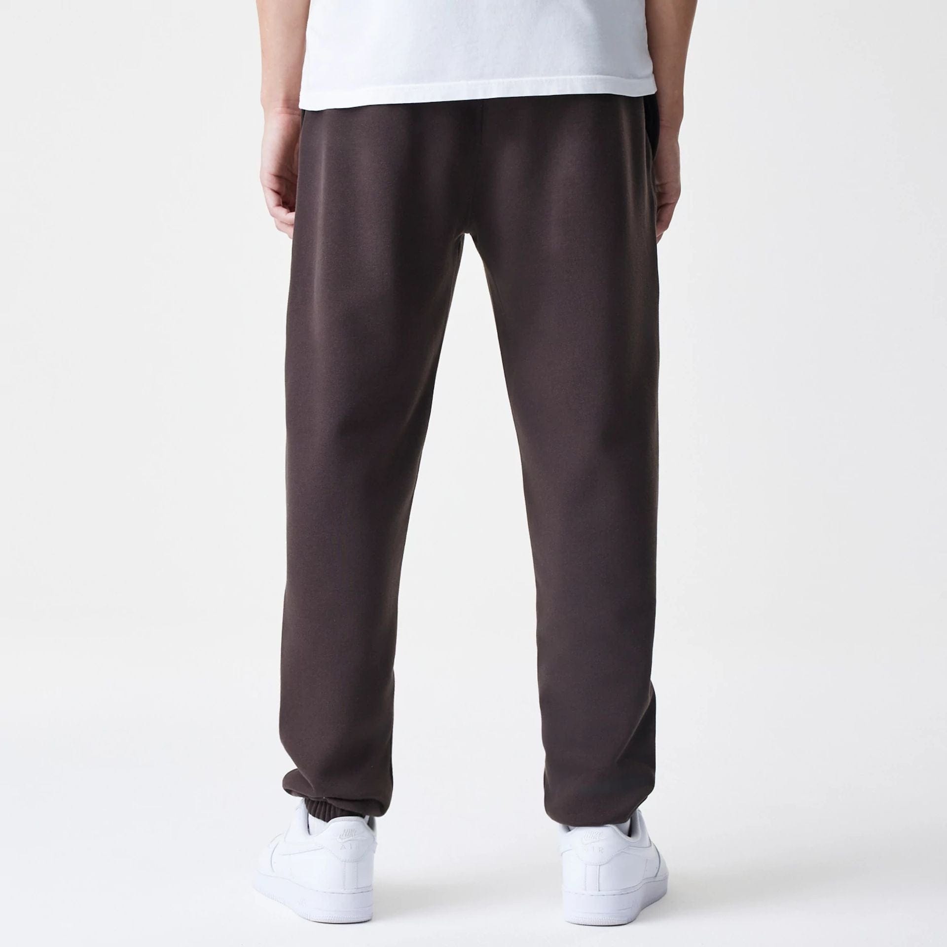 The Male model is wearing New York Yankees MLB Midi League Essential Dark Brown Joggers  2