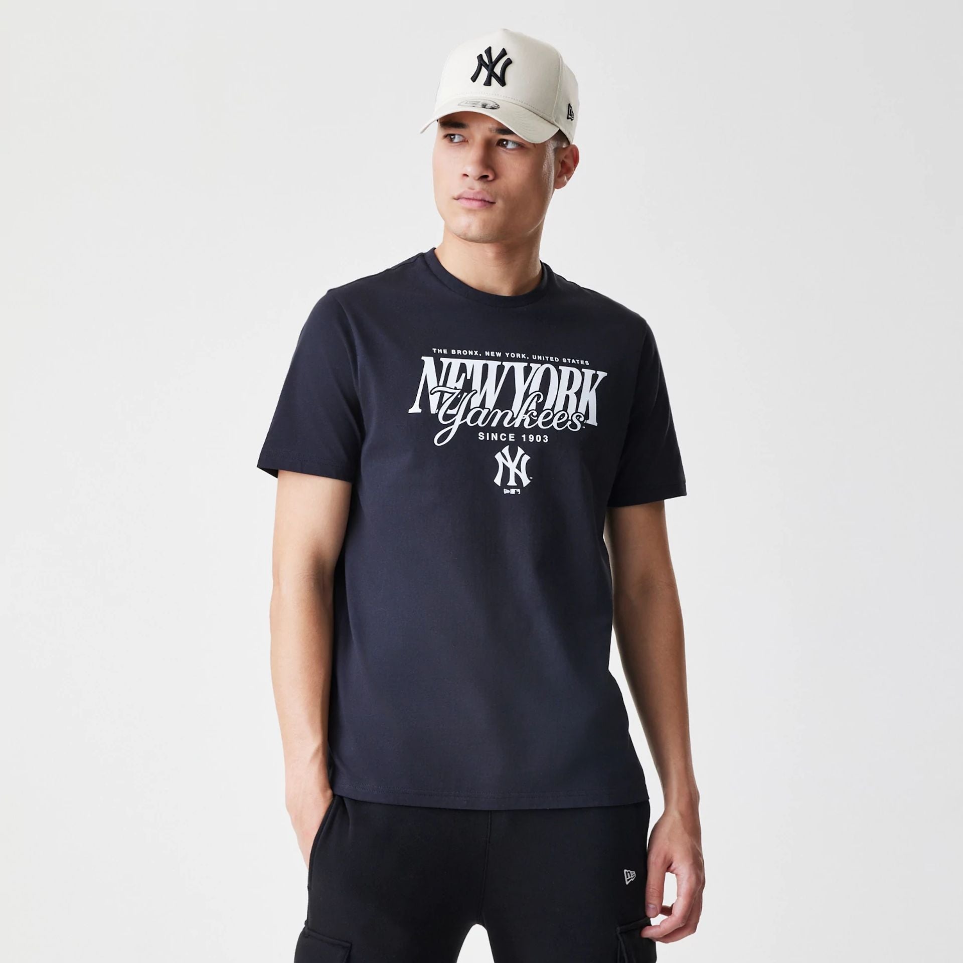 The Male model is wearing New York Yankees MLB Script Graphic Navy T-Shirt  1