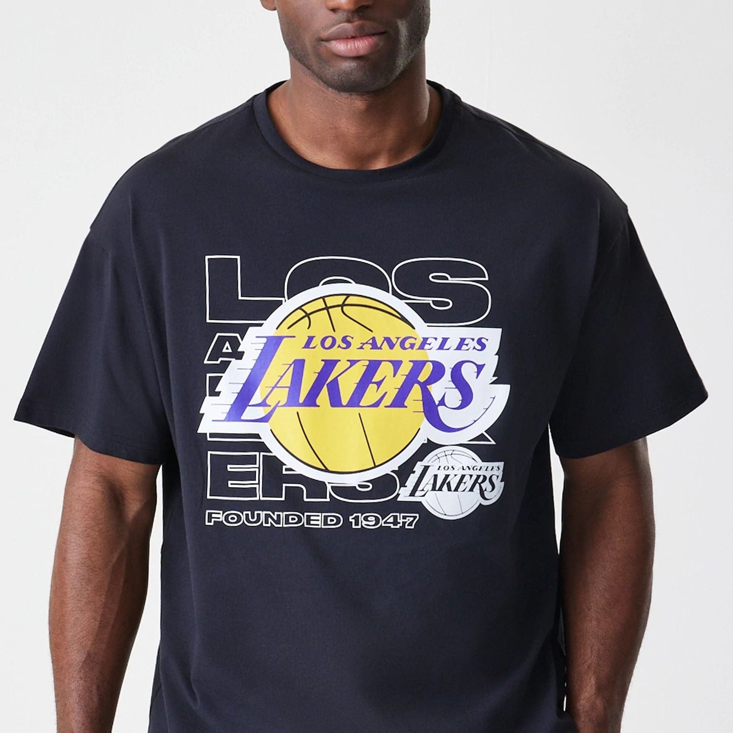 The Male model is wearing LA Lakers NBA Outline Graphic Navy Oversized T-Shirt  3