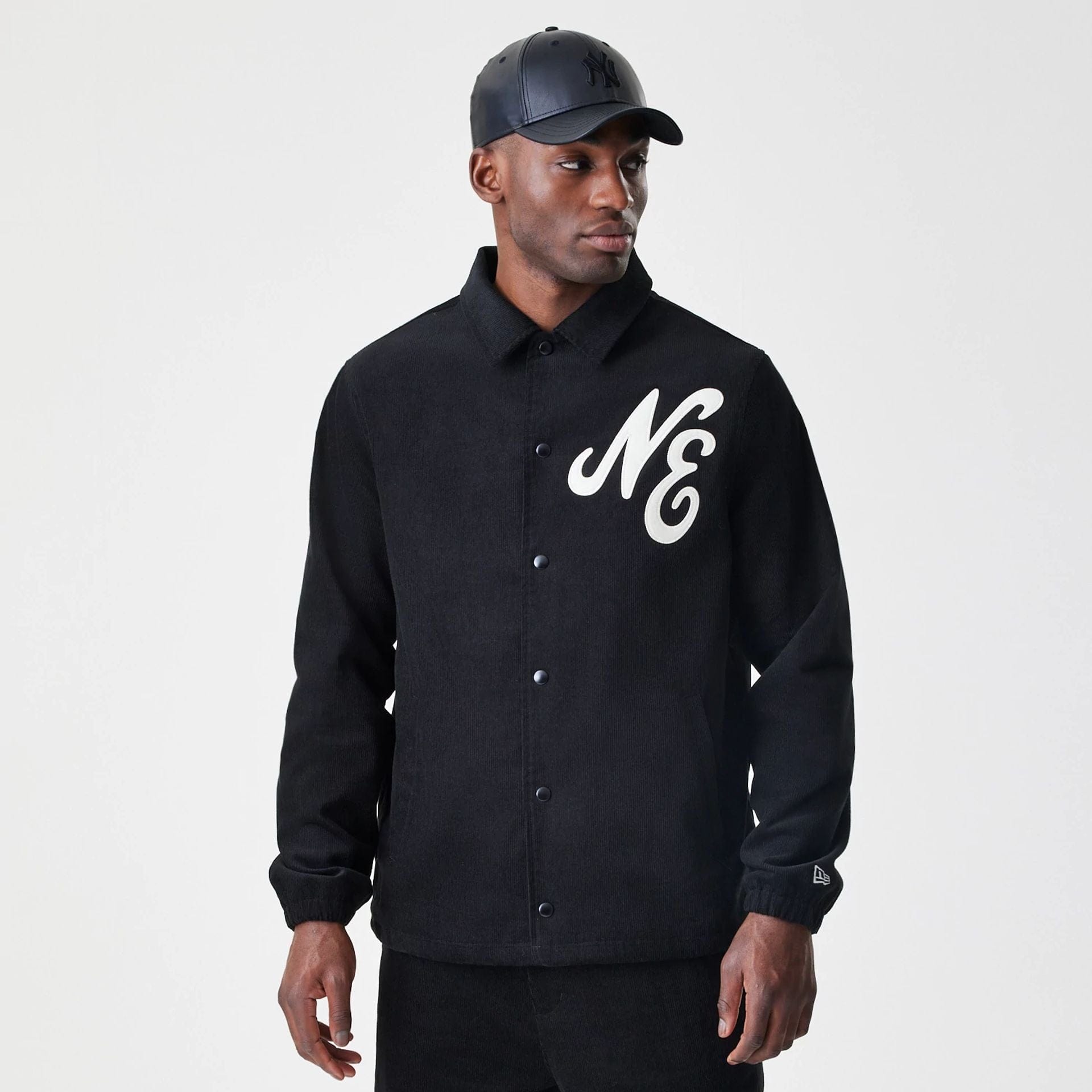 The Male model is wearing  New Era Cord Black Coaches Jacket  3