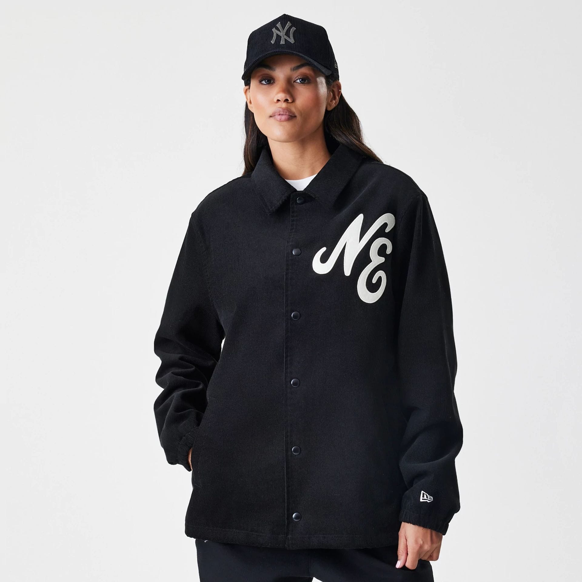 The Male model is wearing  New Era Cord Black Coaches Jacket  4