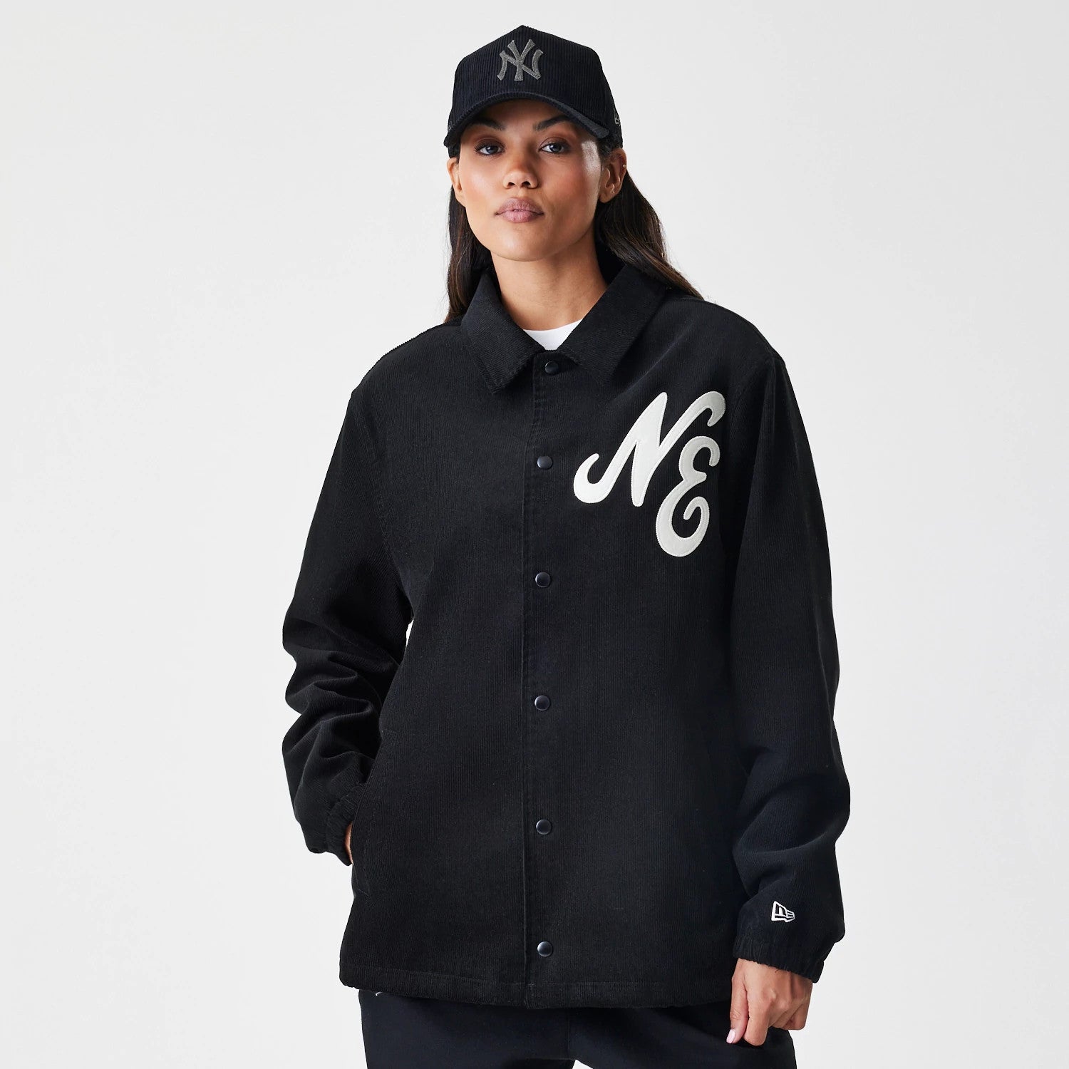 The Male model is wearing  New Era Cord Black Coaches Jacket 4