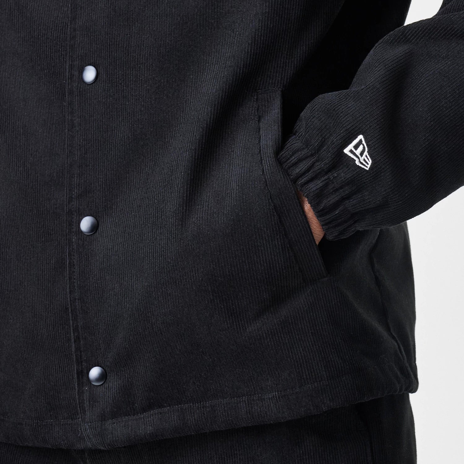 The Male model is wearing  New Era Cord Black Coaches Jacket 7