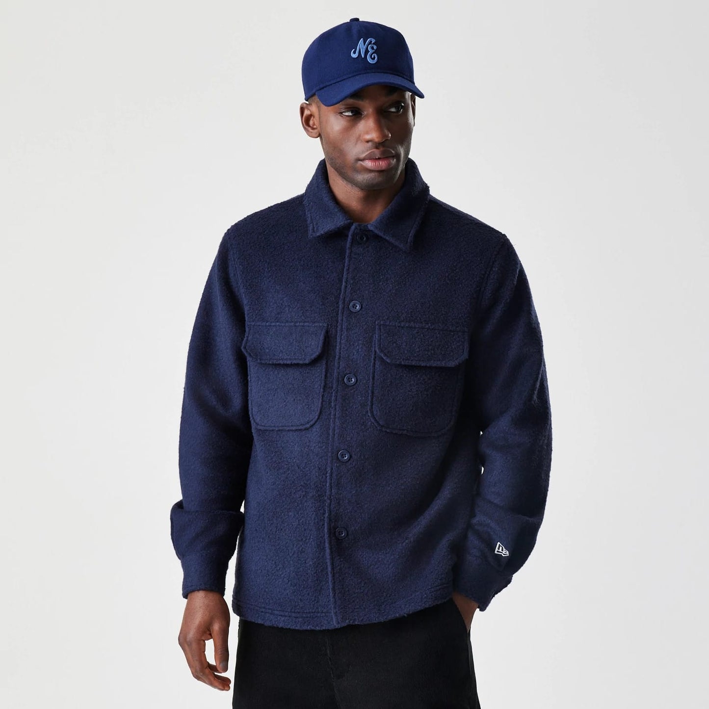 The Male model is wearing  New Era Borg Navy Shacket 1