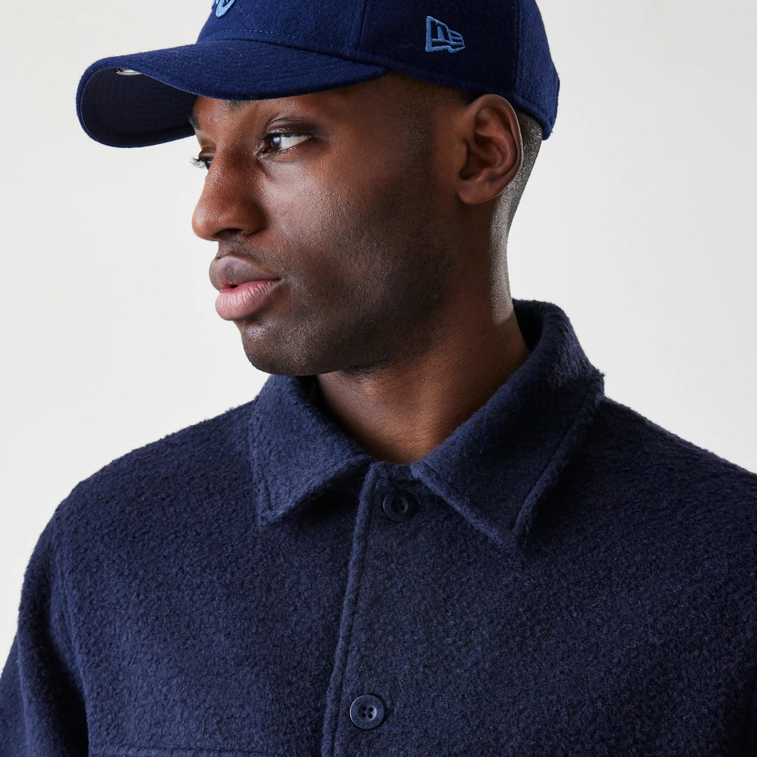 The Male model is wearing  New Era Borg Navy Shacket 4
