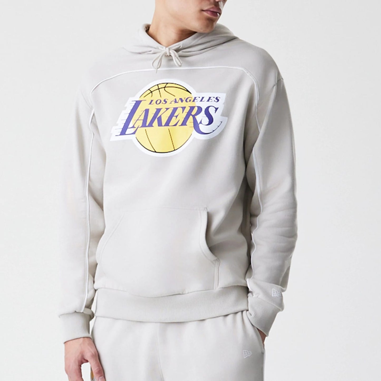 The Male model is wearing LA Lakers NBA Piping Cream Oversized Pullover Hoodie 3