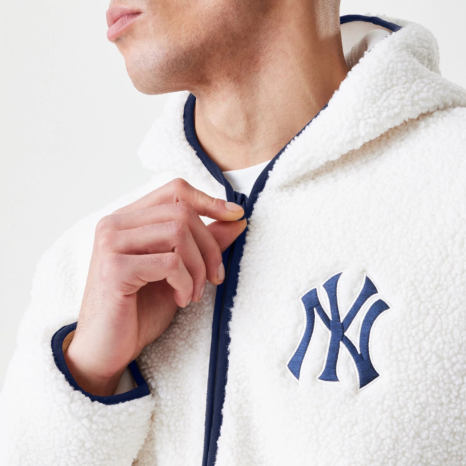 The Male model is wearing New York Yankees MLB Open White Hooded Sherpa Jacket 5