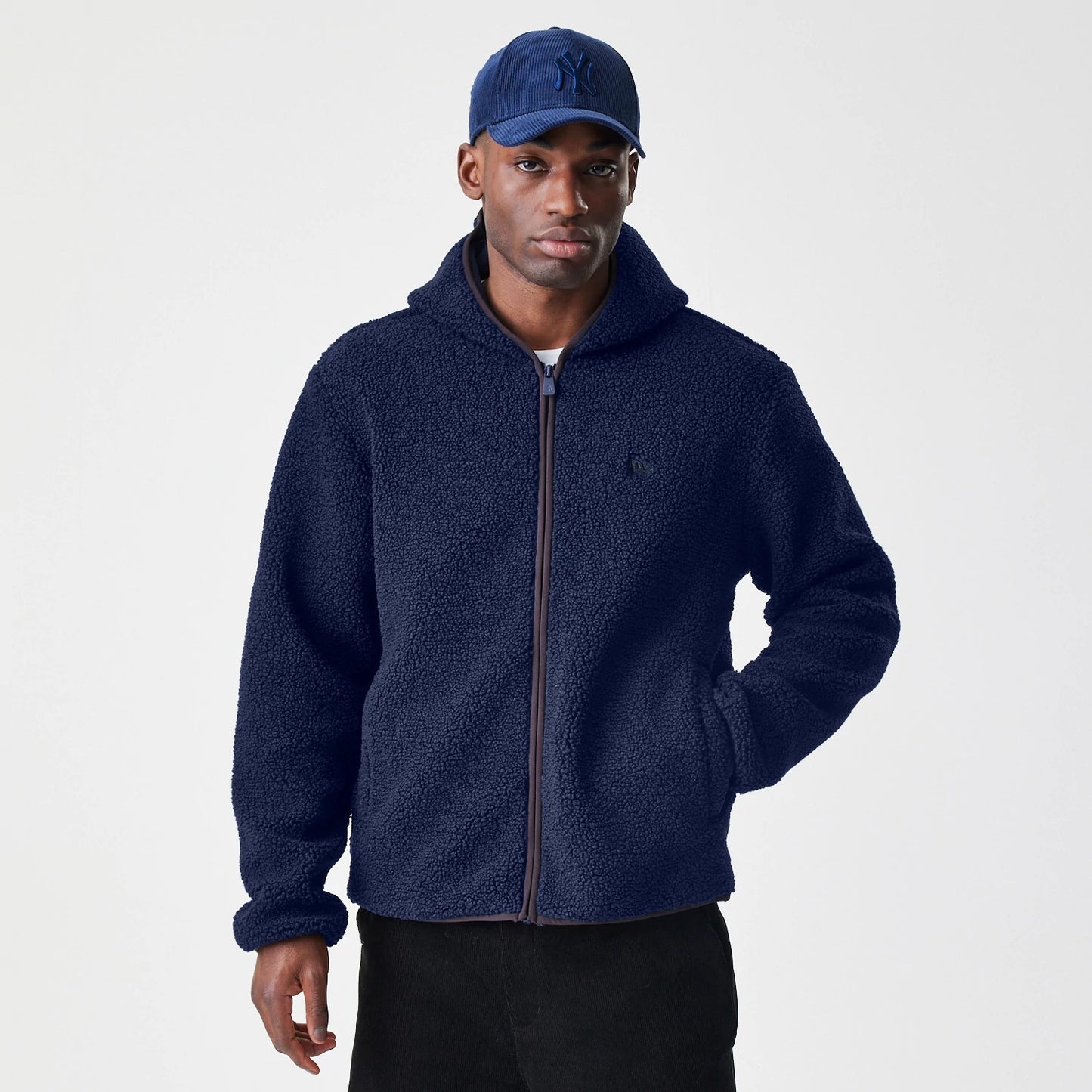 The Male model is wearing  New Era Navy Hooded Sherpa Jacket 3