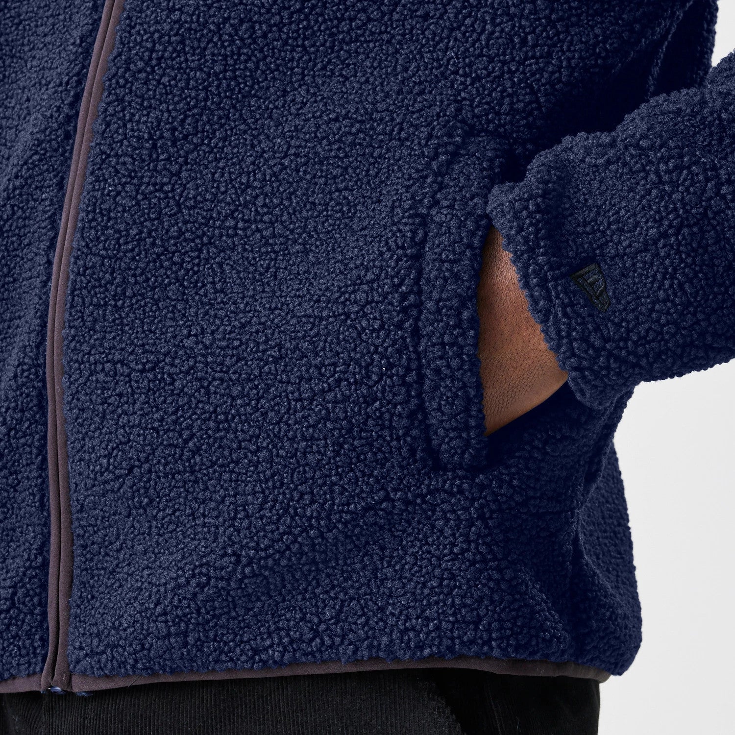 The Male model is wearing  New Era Navy Hooded Sherpa Jacket 7