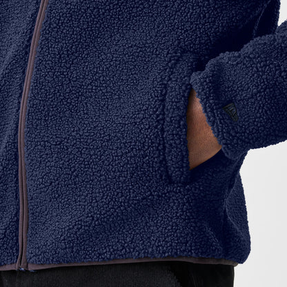 The Male model is wearing  New Era Navy Hooded Sherpa Jacket 7