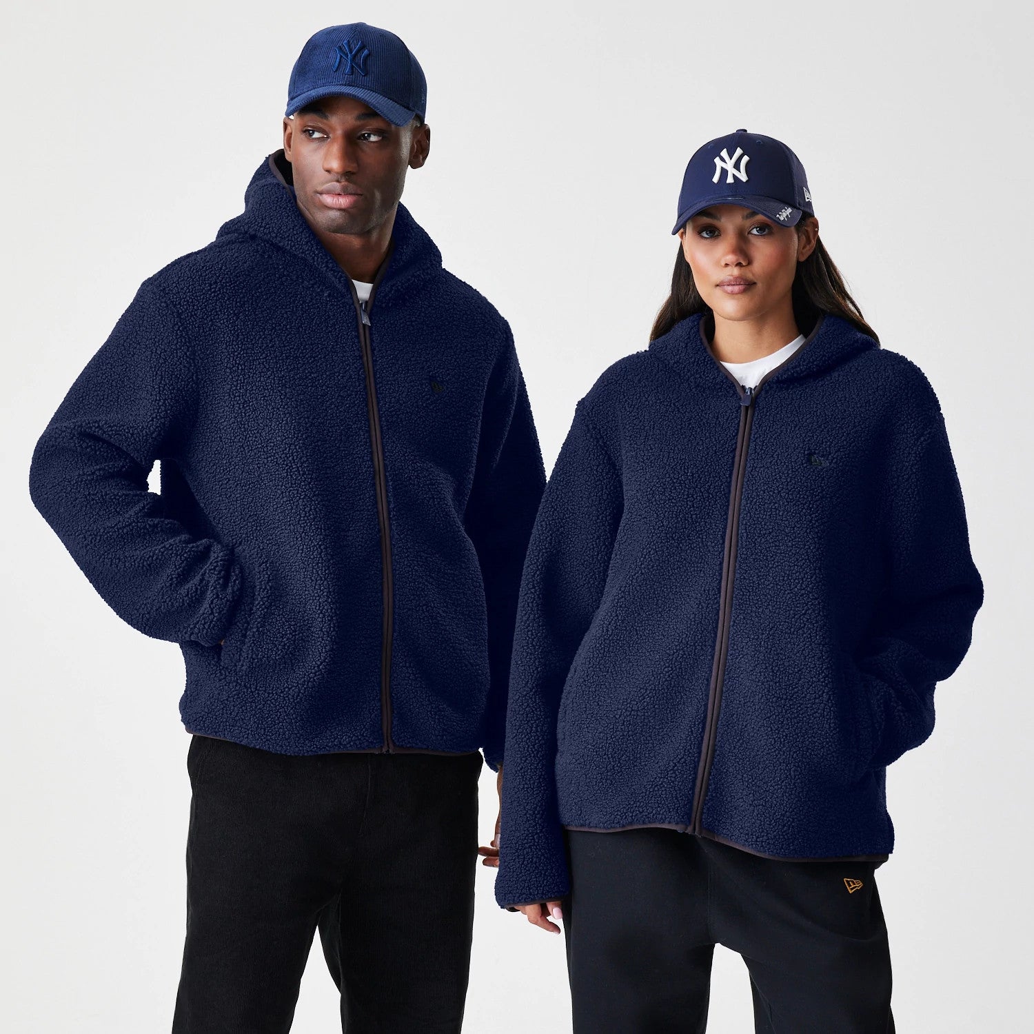 The Male model is wearing  New Era Navy Hooded Sherpa Jacket 1