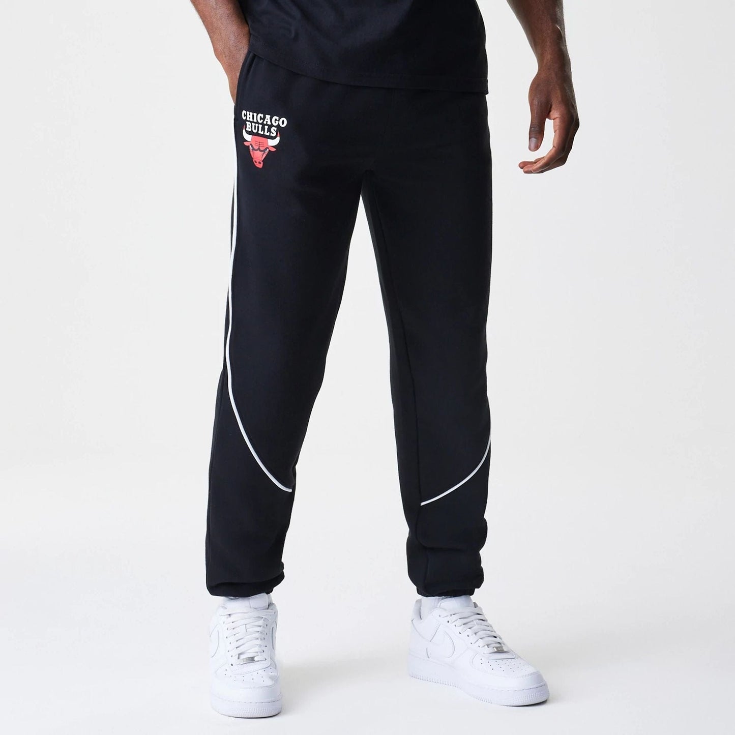 The Male model is wearing Chicago Bulls NBA Piping Navy Joggers  1
