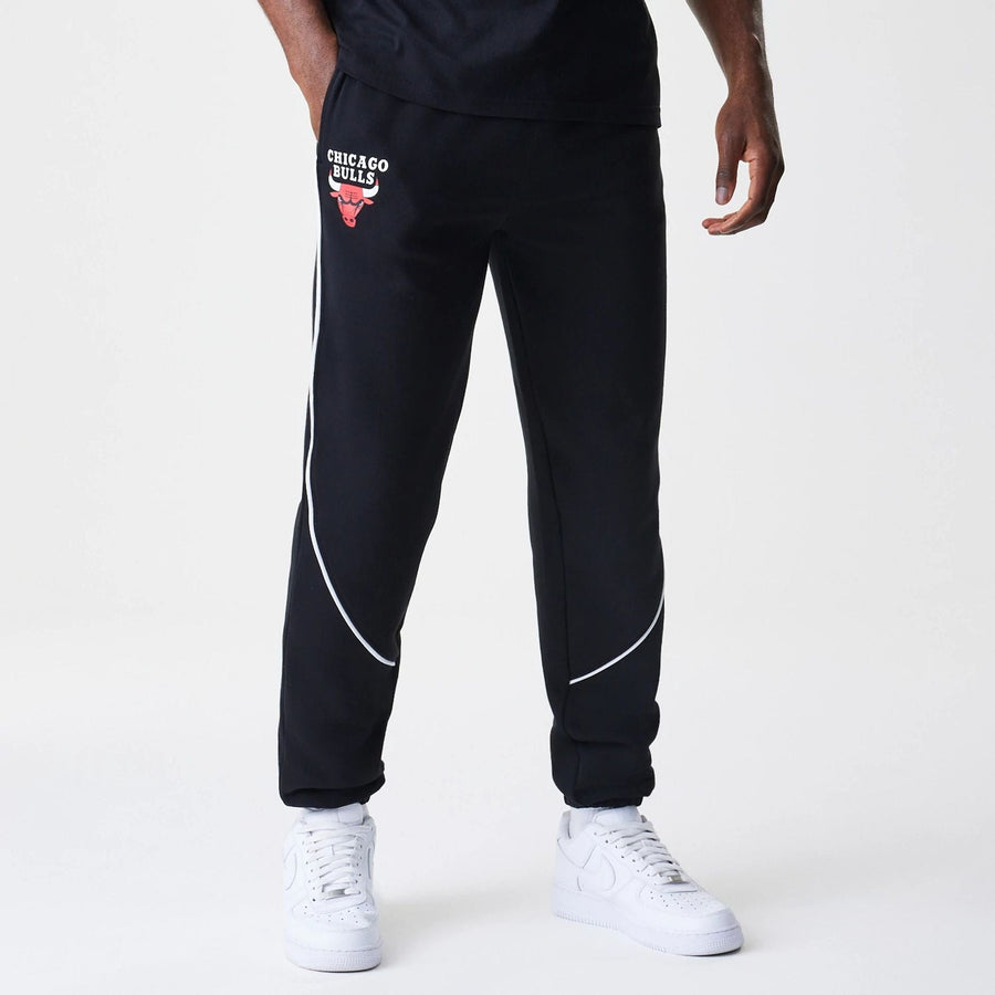 The Male model is wearing Chicago Bulls NBA Piping Navy Joggers  1