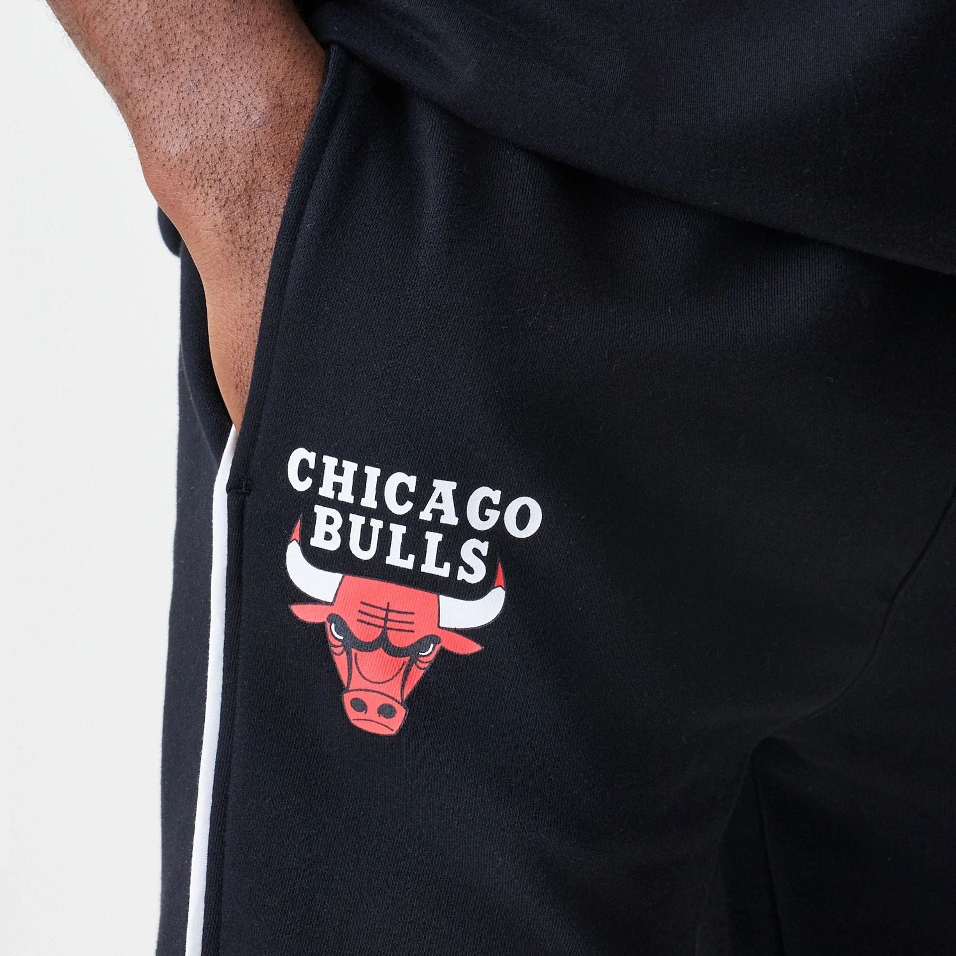 The Male model is wearing Chicago Bulls NBA Piping Navy Joggers  3