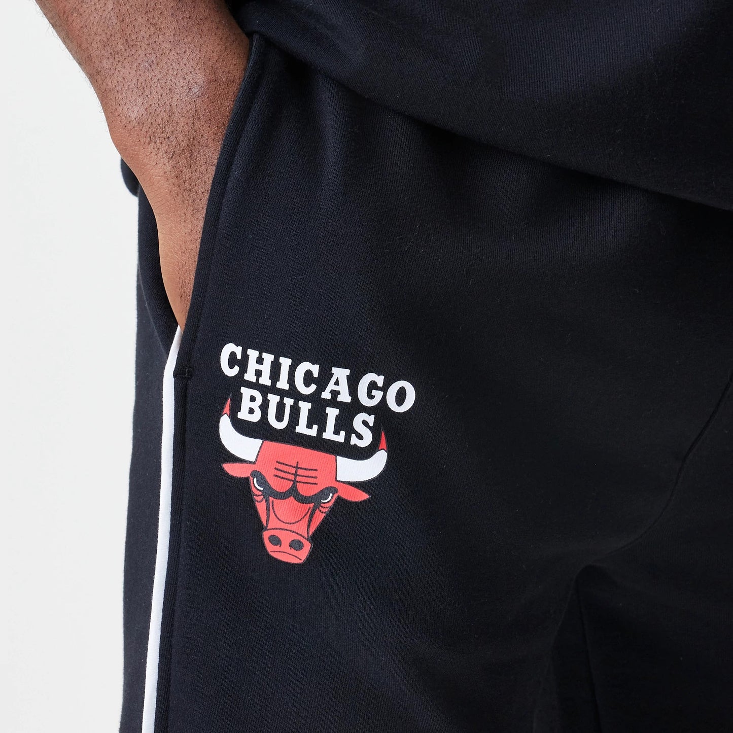 The Male model is wearing Chicago Bulls NBA Piping Navy Joggers 3