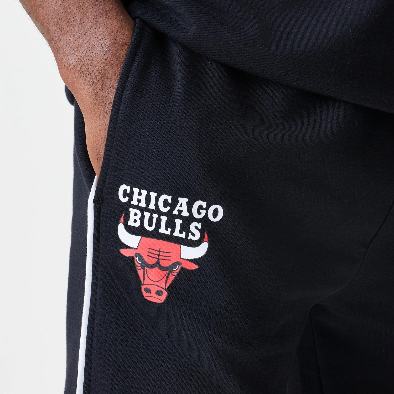 The Male model is wearing Chicago Bulls NBA Piping Navy Joggers 3