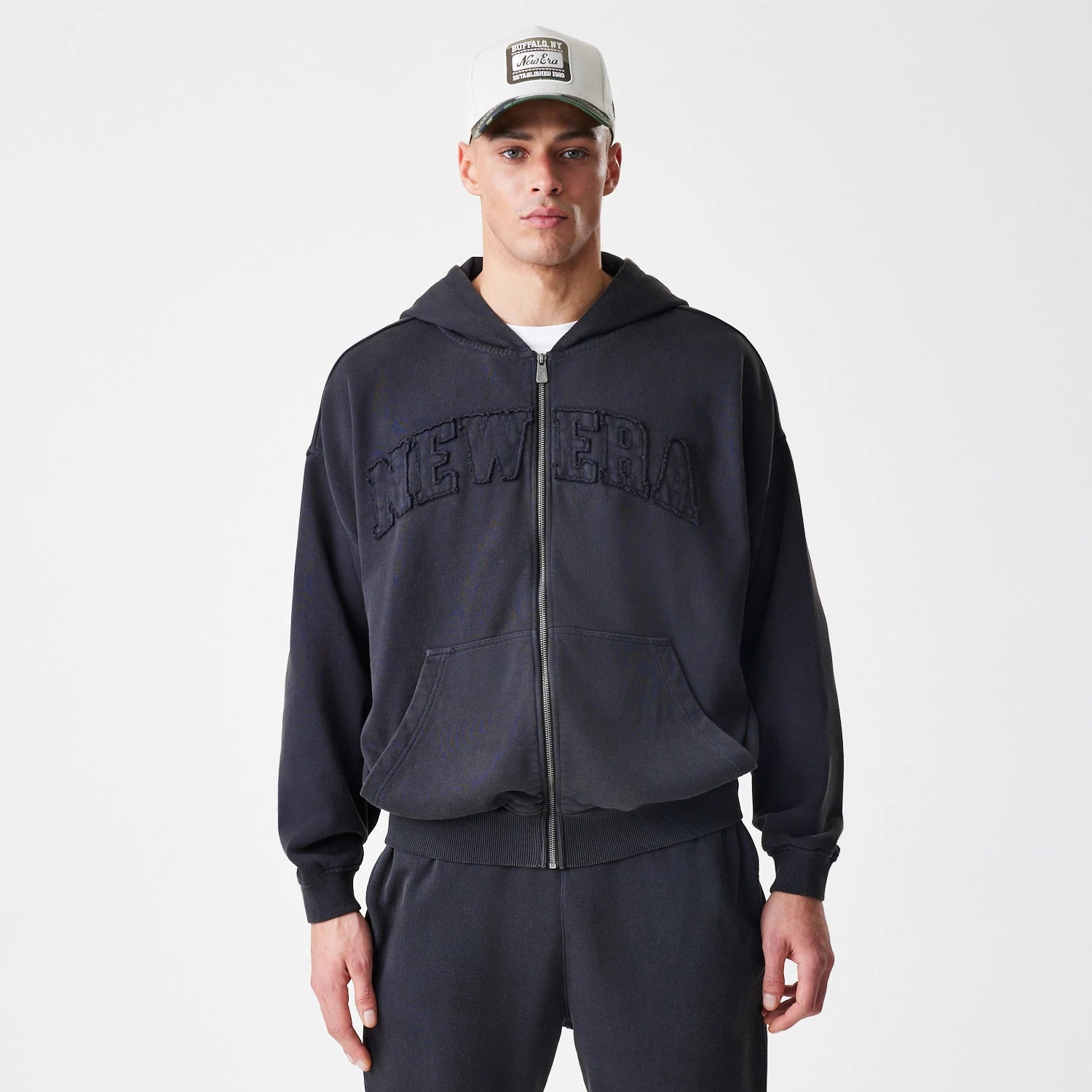 The Male model is wearing  New Era Washed Black Oversized Full Zip Hoodie 3