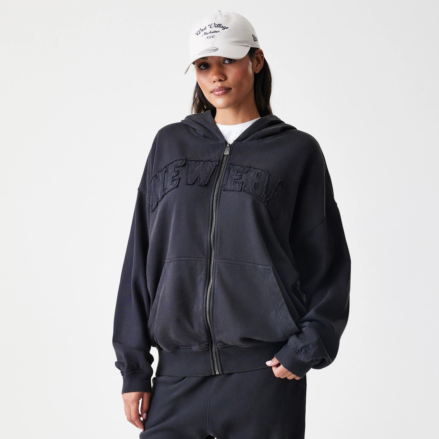 The Male model is wearing  New Era Washed Black Oversized Full Zip Hoodie 4