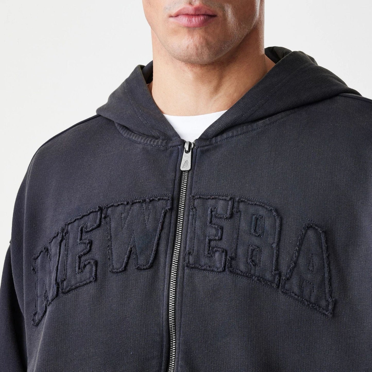 The Male model is wearing  New Era Washed Black Oversized Full Zip Hoodie  5