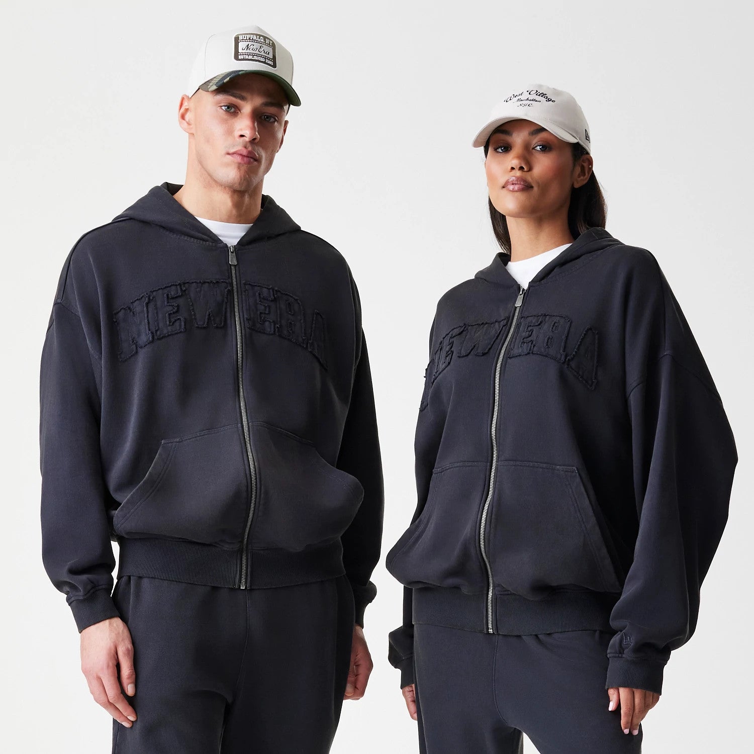 The Male model is wearing  New Era Washed Black Oversized Full Zip Hoodie 1
