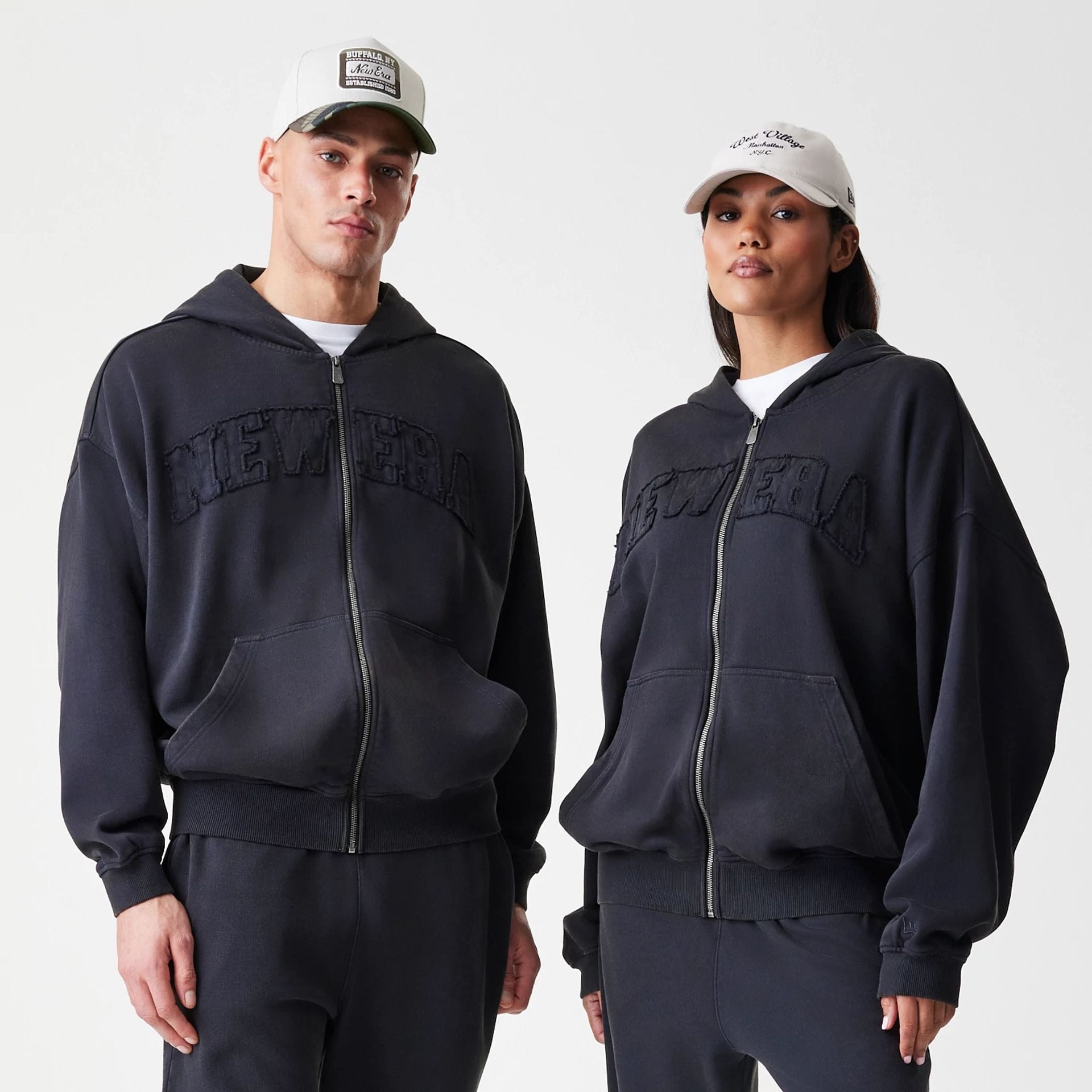 The Male model is wearing  New Era Washed Black Oversized Full Zip Hoodie  1