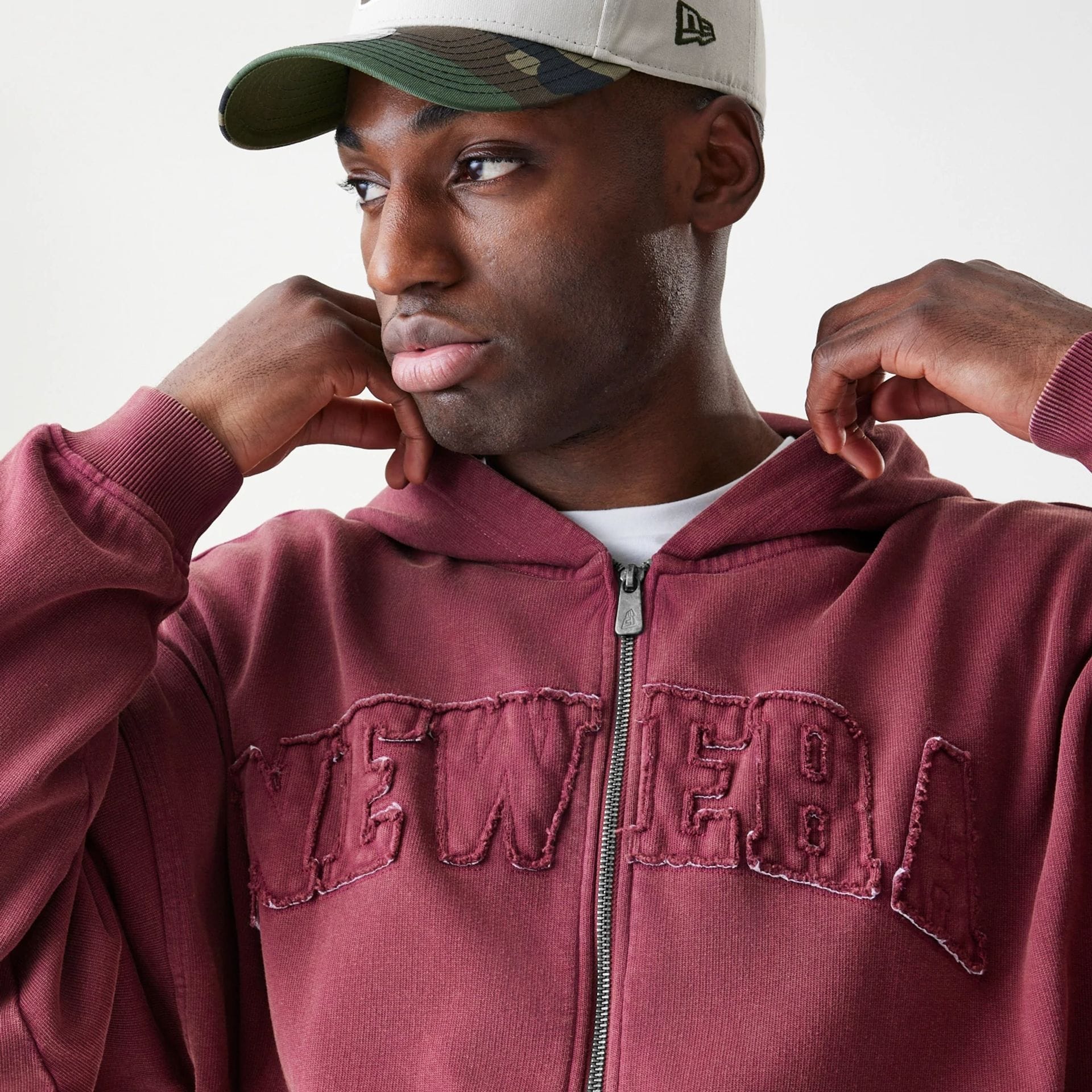 The Male model is wearing  New Era Washed Dark Red Oversized Full Zip Hoodie  5